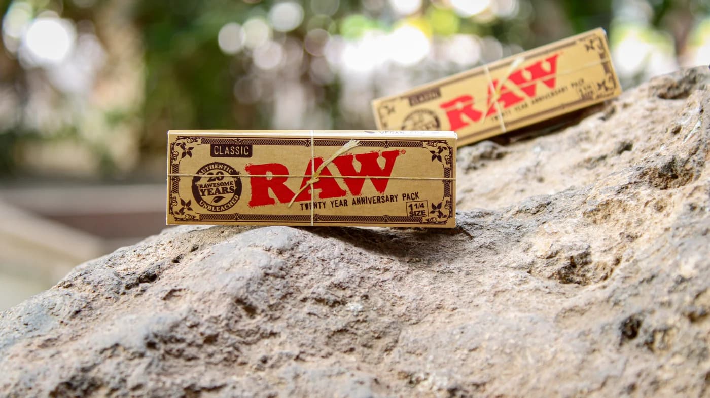 RAW Classic twenty year anniversary rolling paper packs in one and a quarter size, the standard booklets sold by most UK retailers