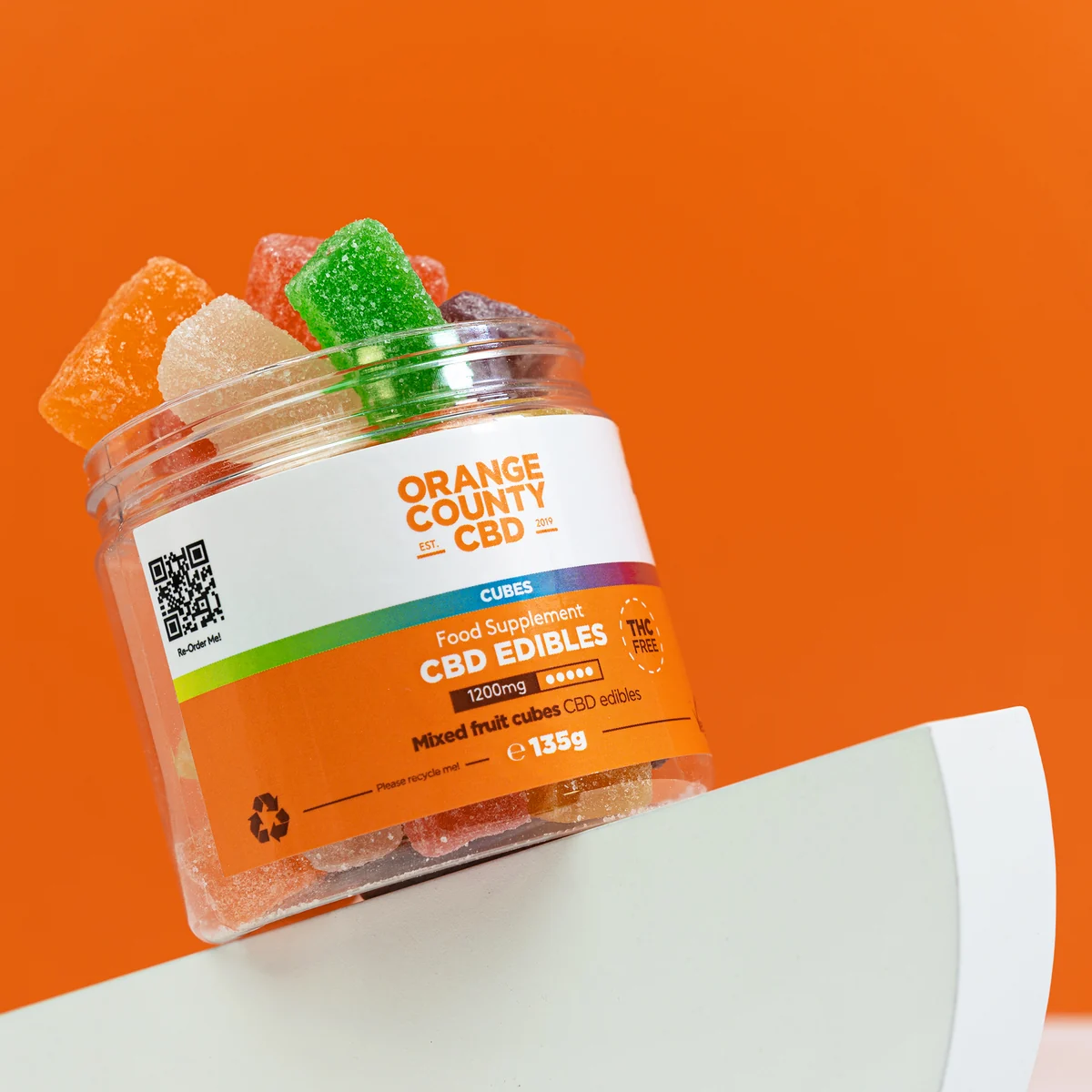 Orange County CBD 1200mg mixed fruit cubes edibles jar on the brand's orange campaign background